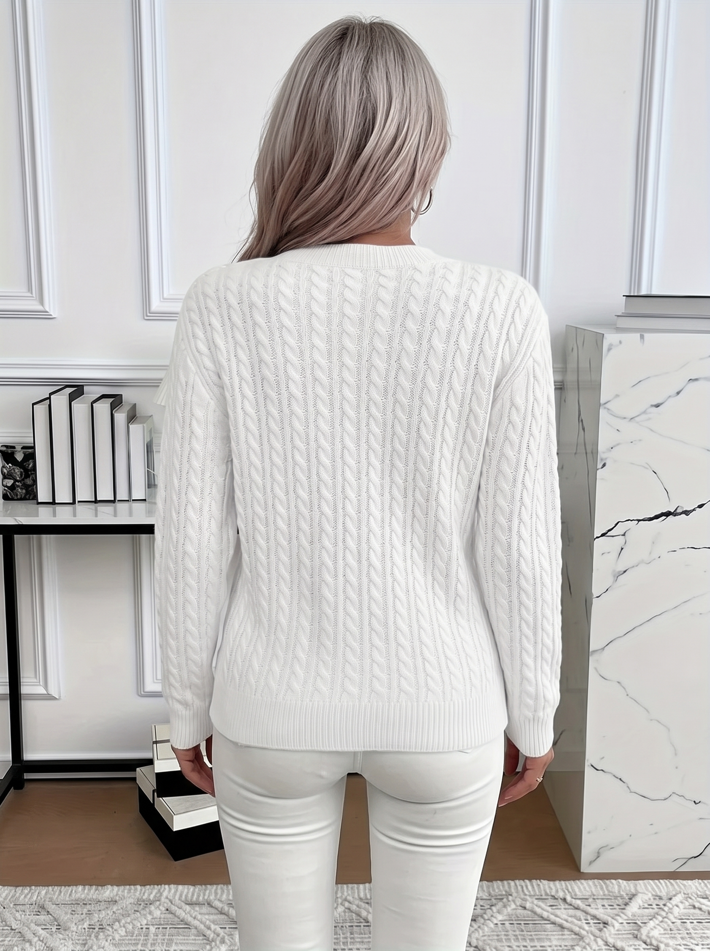 Back view of the Evelyn cozy cable knit sweater in white
