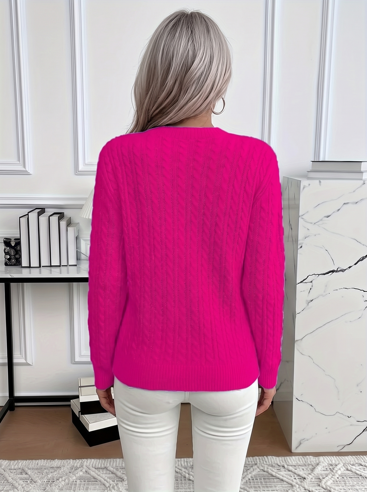 Back view of the Evelyn cozy cable knit sweater in fuchsia