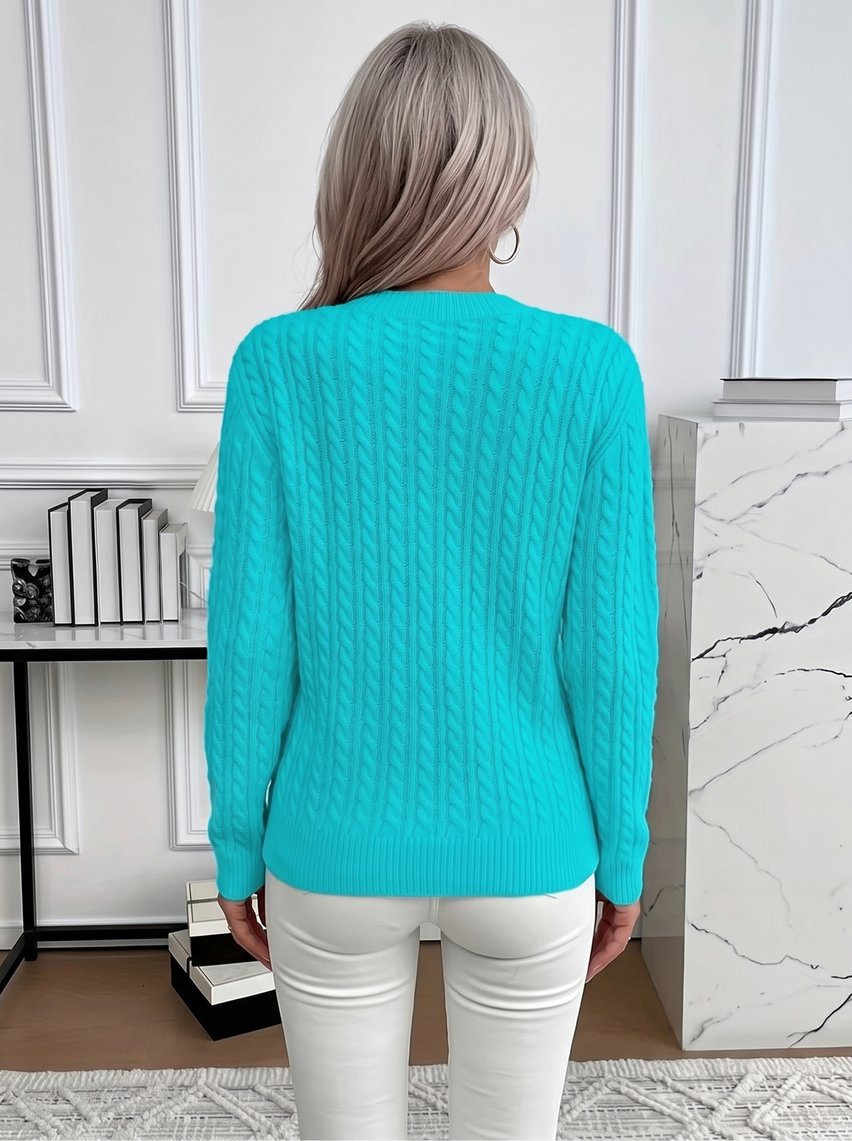 Back view of the Evelyn cozy cable knit sweater in turquoise