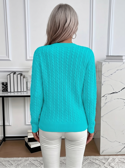 Back view of the Evelyn cozy cable knit sweater in turquoise