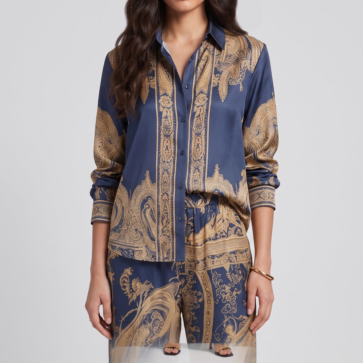 Close view of the gold baroque print and button placket on the Vivian shirt