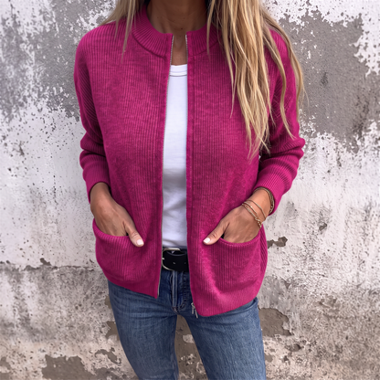 Sylvia zip-front knit cardigan in Fuchsia, front view with hands resting in the deep patch pockets