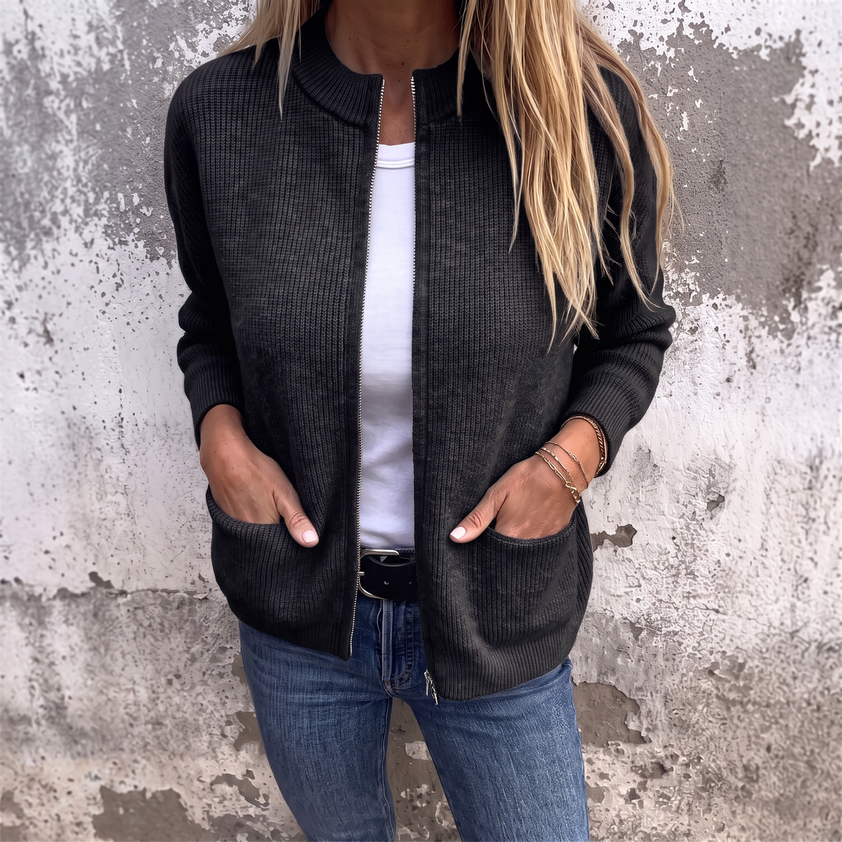Sylvia zip-front knit cardigan in Black, front view showing the full-length zip and ribbed stand collar