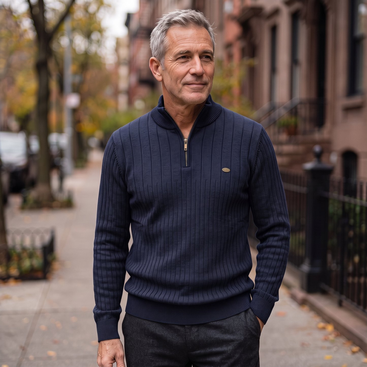 Man wearing the Vaughn quarter-zip sweater in navy on a city sidewalk