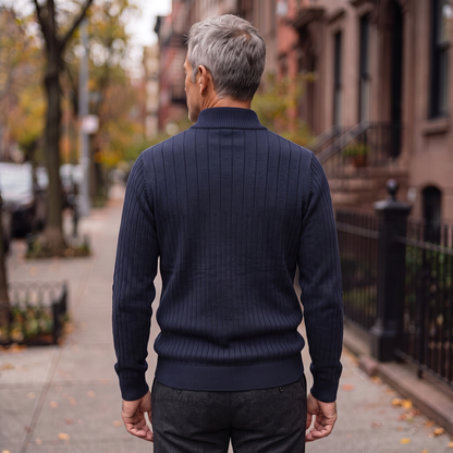 Back view of the Vaughn quarter-zip sweater in navy, showing the continuous vertical rib