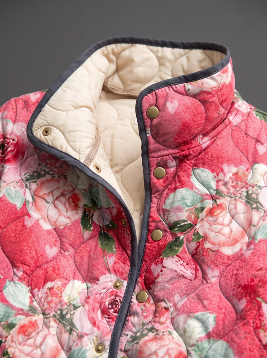 Close view of the stand collar, brass snaps and cream quilted lining on the Clementine jacket