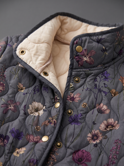 Close view of the stand collar, brass snaps and cream quilted lining on the Agnes jacket