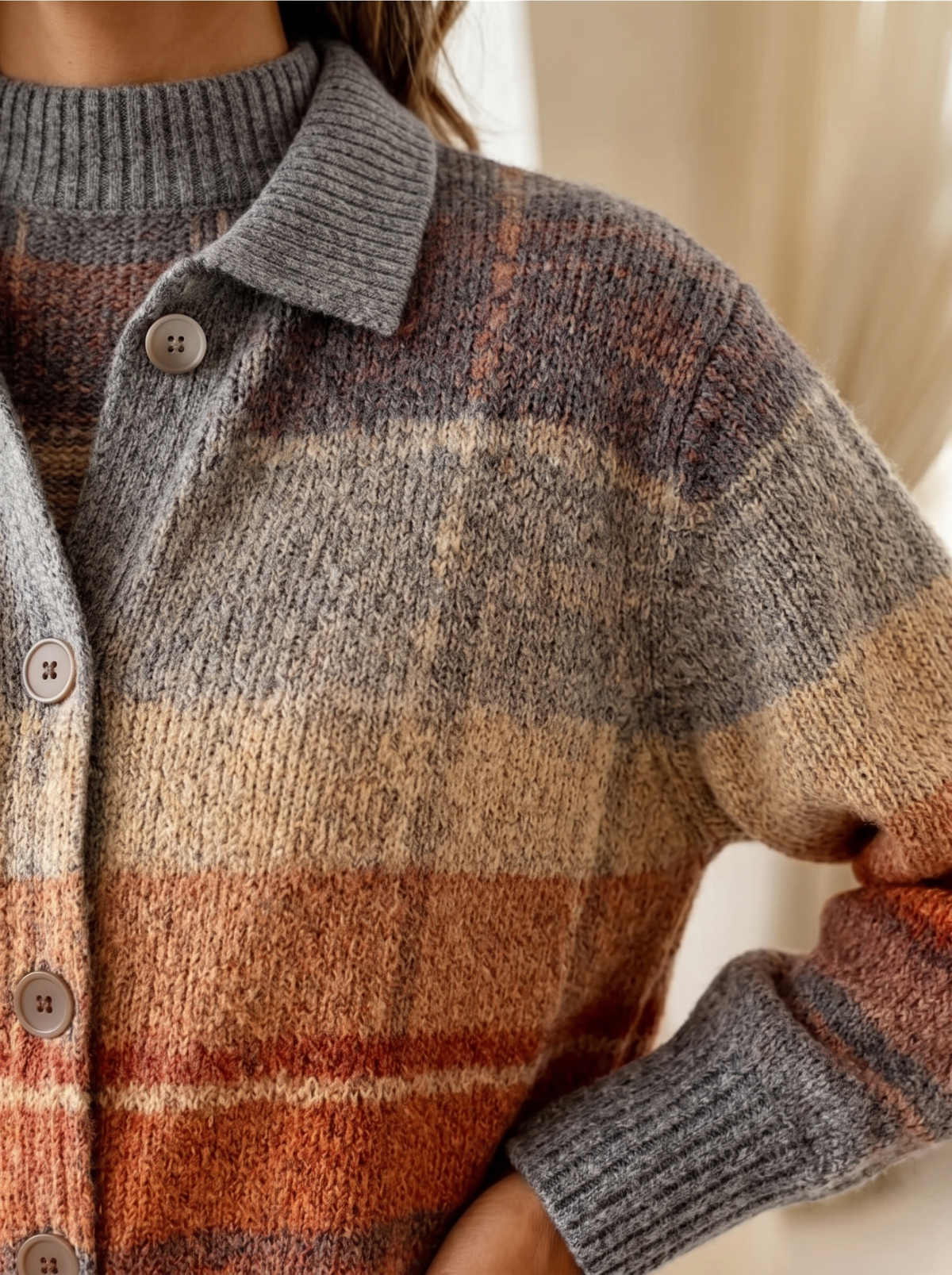 Close view of the collar, buttons and ribbed cuff on the Mildred plaid cardigan