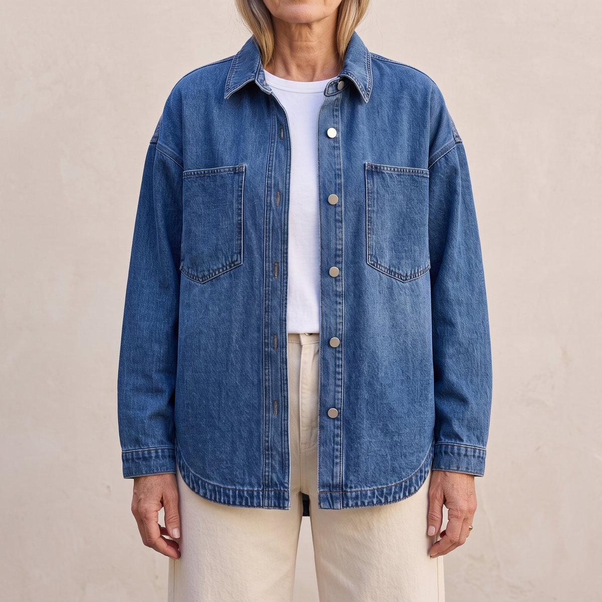 Bess oversized washed denim jacket in Blue, worn open over a white top