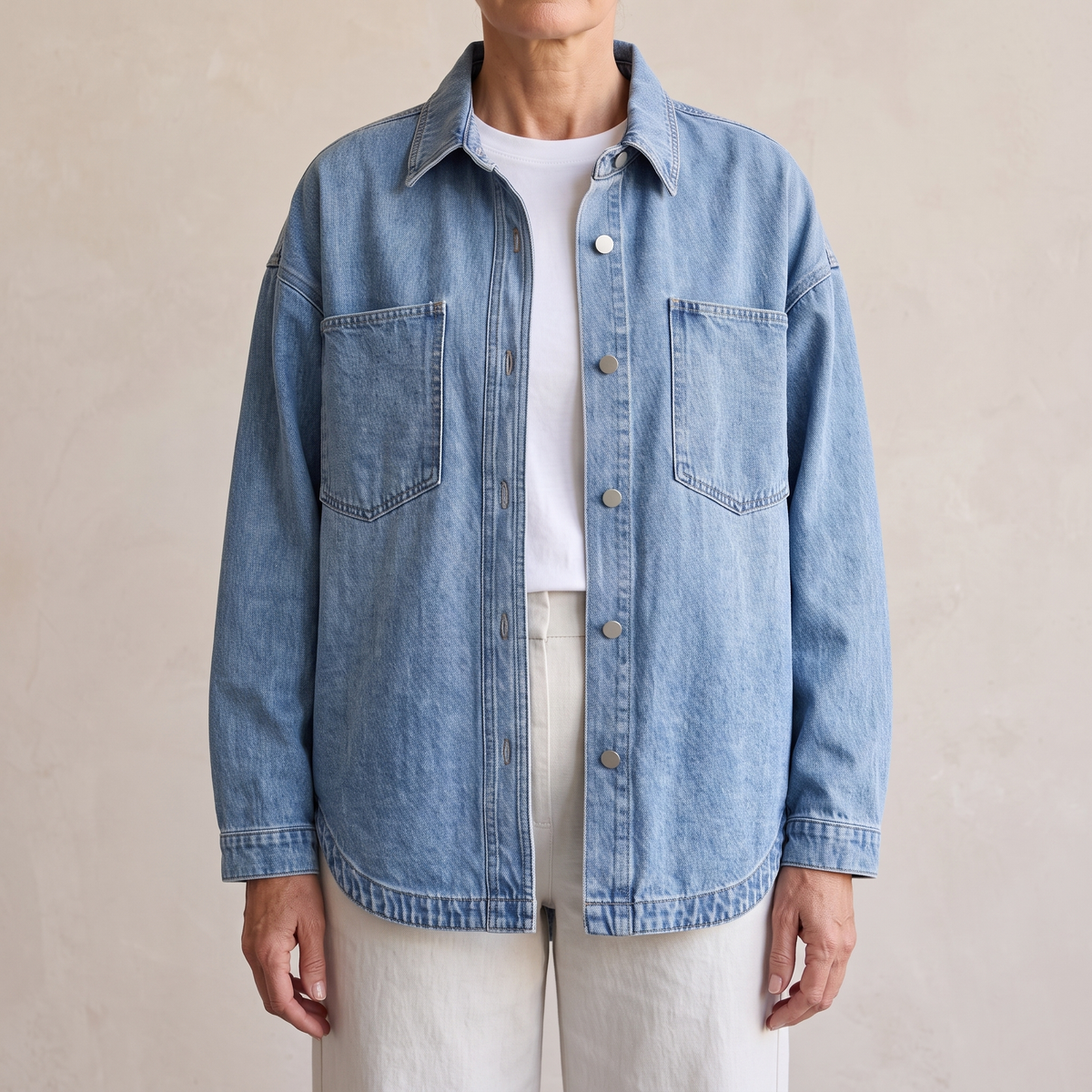 Bess oversized washed denim jacket in Light Blue, worn open over a white top and light wide-leg trousers