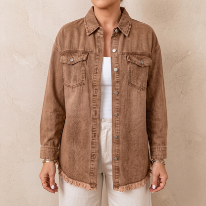 Dottie raw hem denim jacket in brown, worn open over a white top