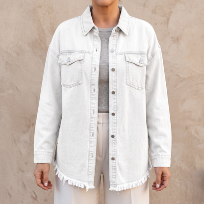 Dottie raw hem denim jacket in white, showing the raw frayed hem and chest patch pockets