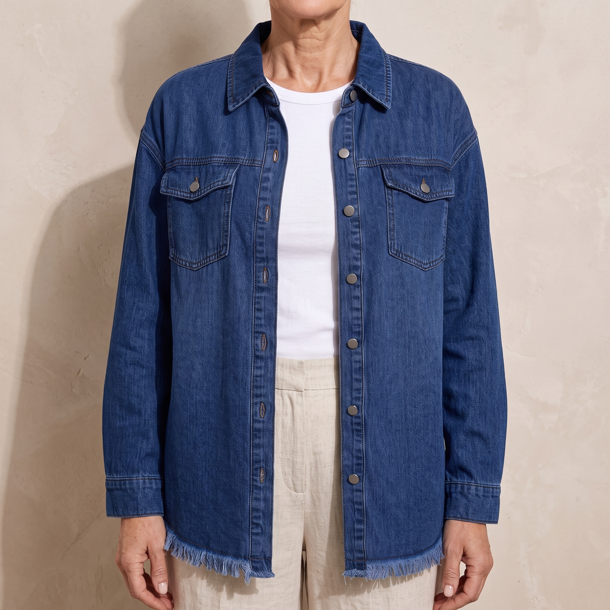 Dottie raw hem denim jacket in dark blue, worn open over a white top