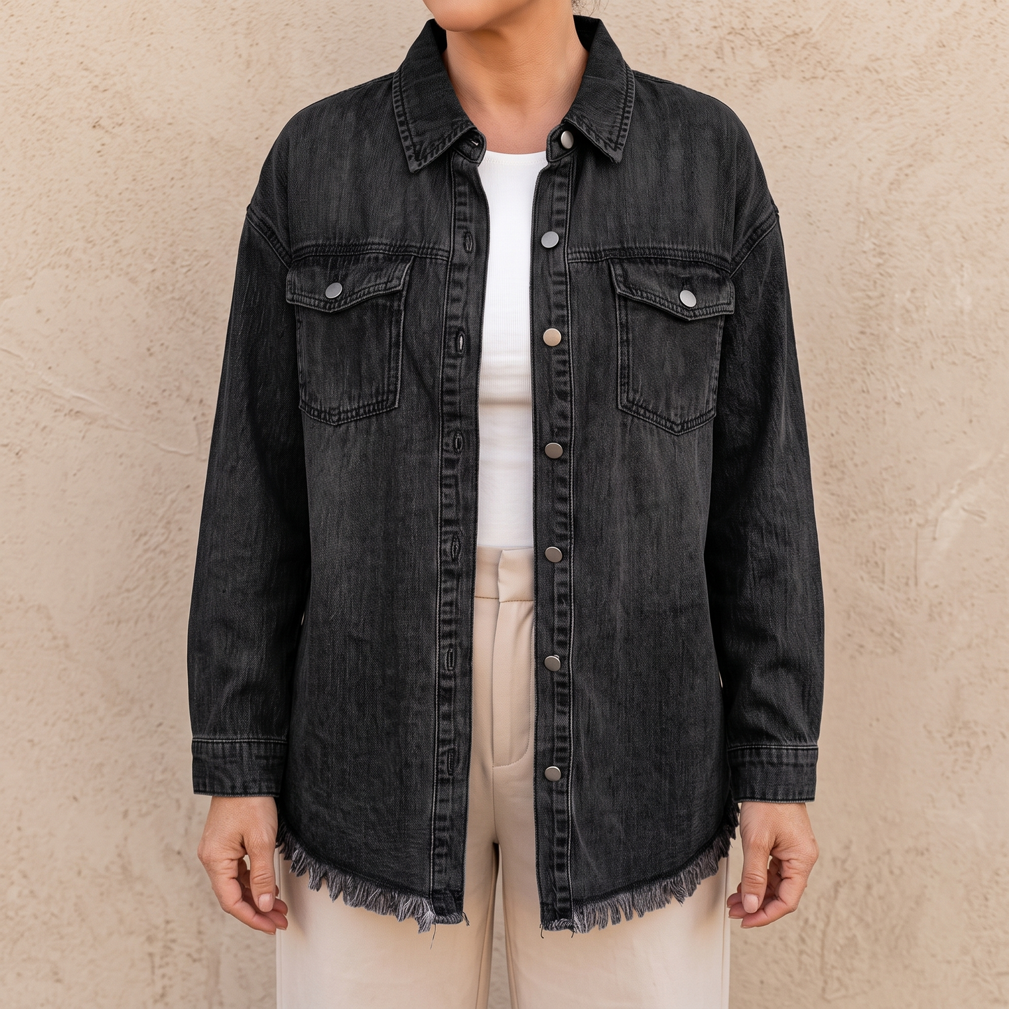 Dottie raw hem denim jacket in black, showing the frayed hem and side vent
