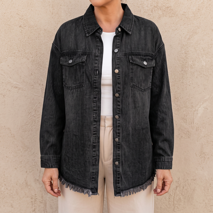 Dottie raw hem denim jacket in black, showing the frayed hem and side vent