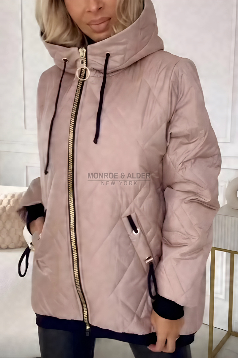 Ida puffer jacket in dusty pink with the stand-up collar zipped and hood up