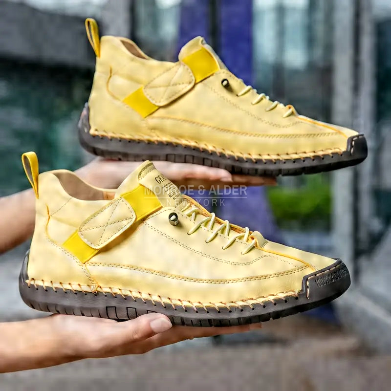 Lena comfort sneaker in Yellow, pair held in hand