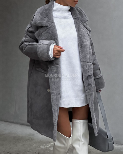 Close view of the gray Lenora coat with plush lapels and turned-back cuffs