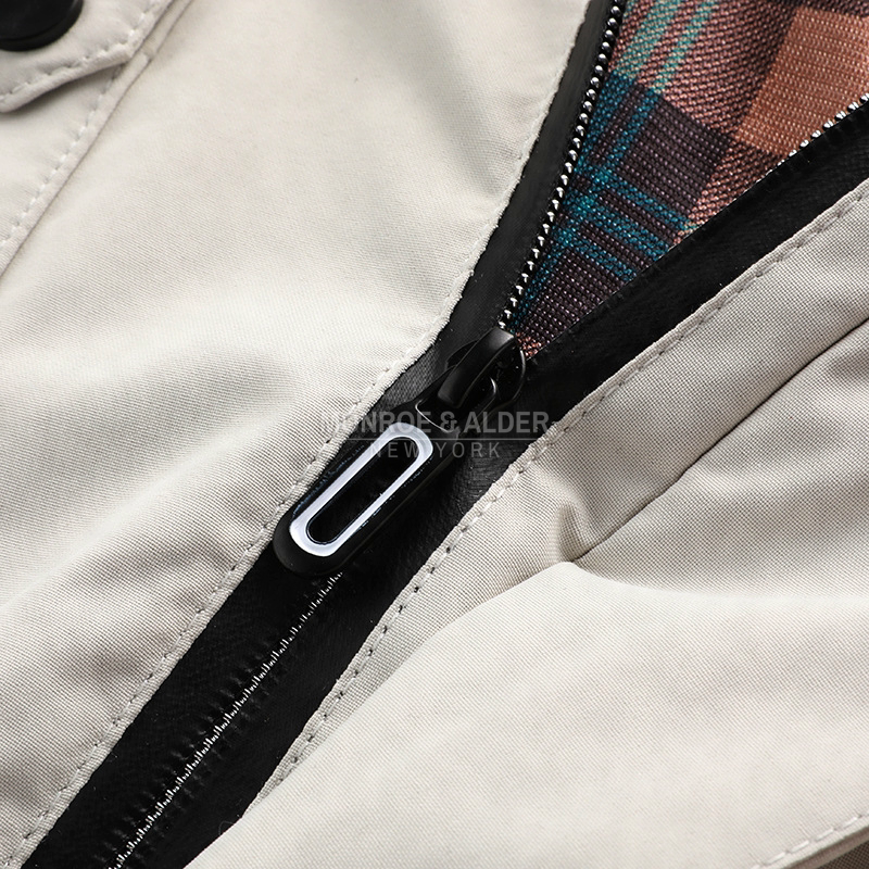 Close view of the front zipper and plaid lining
