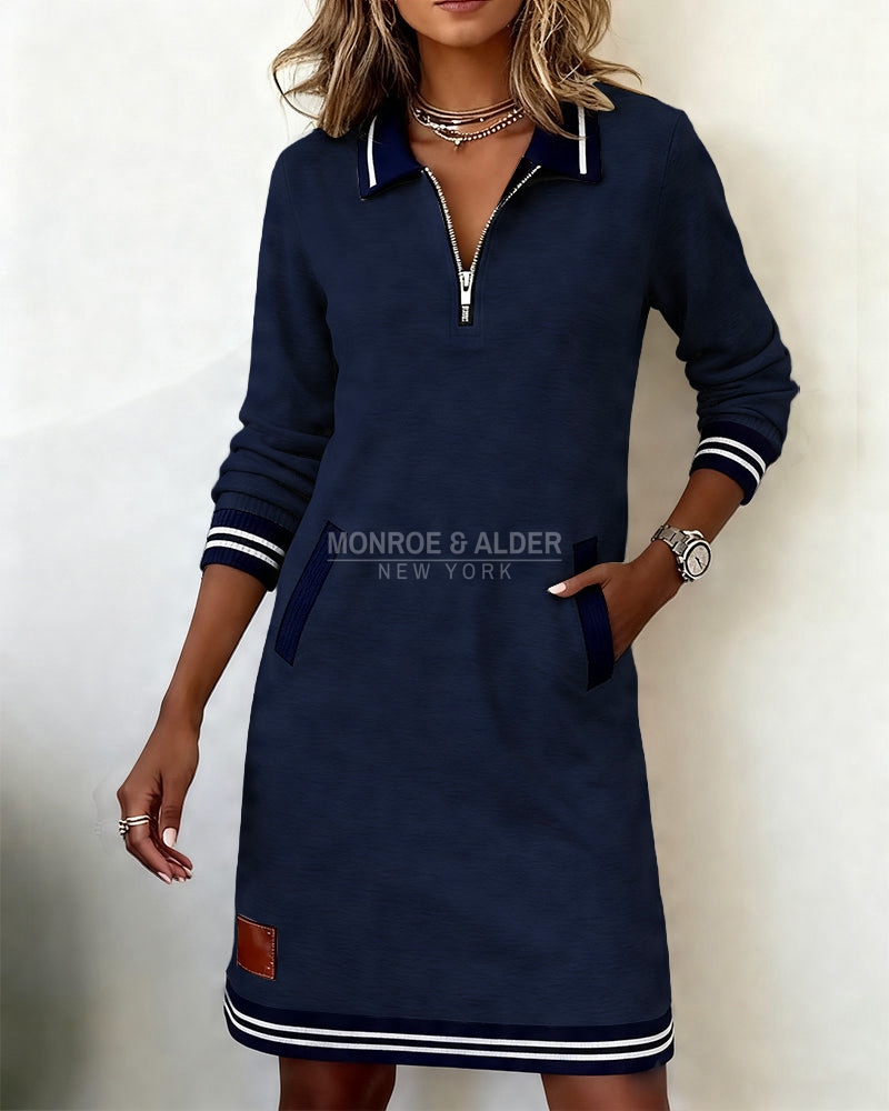 Marietta zip dress in navy with hand in side pocket