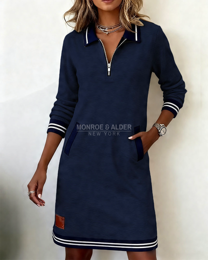Marietta zip dress in navy with hand in side pocket