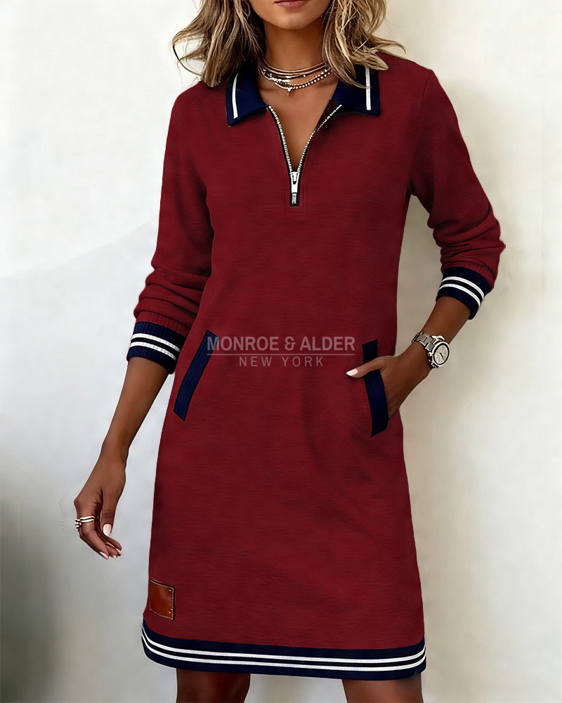 Marietta zip dress in burgundy with hand in side pocket
