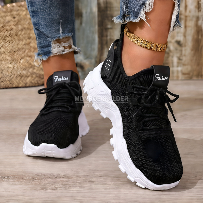 Molly sneaker in black, worn side view