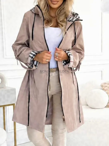 Odessa hooded zip jacket in beige, worn open with plaid cuffs