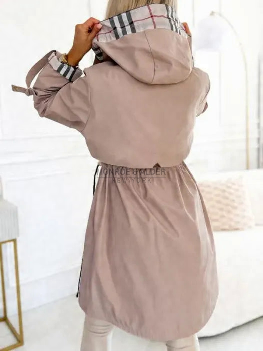 Back view of the Odessa jacket in beige with drawstring waist and hood