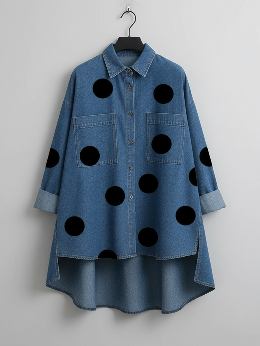 Blue polka dot overshirt shown flat on a hanger, with the shorter front and longer back clearly visible