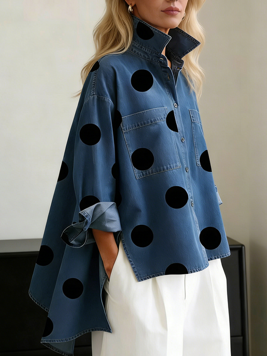 Blue polka dot overshirt worn open over white trousers, side view showing the wide side panels