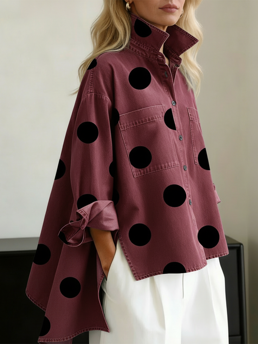 Burgundy polka dot overshirt with black dots, worn over white trousers