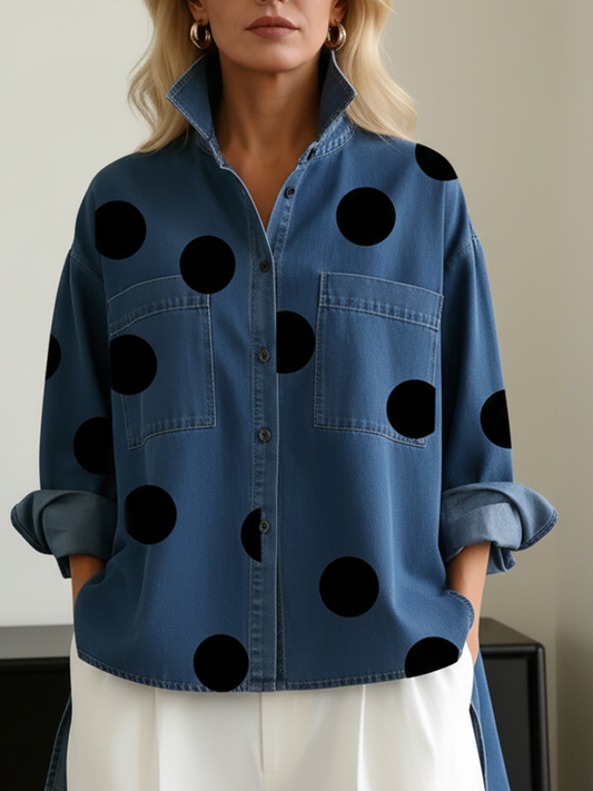 Blue polka dot overshirt from the front with the cuffs folded back and hands in the pockets
