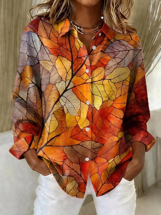 Penelope blouse with an orange and red autumn leaf print, front view