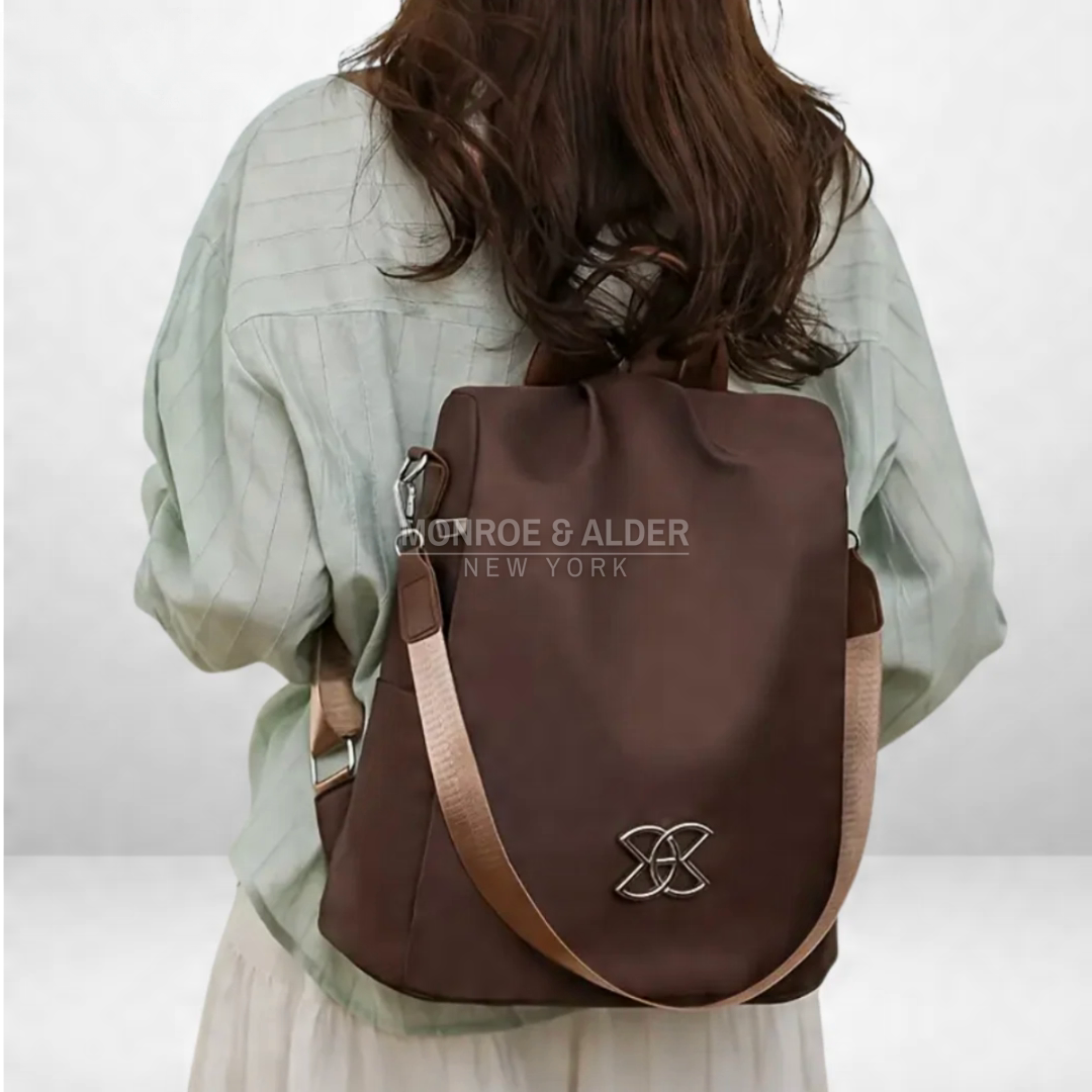 Rosanne anti-theft bag in brown worn on the back