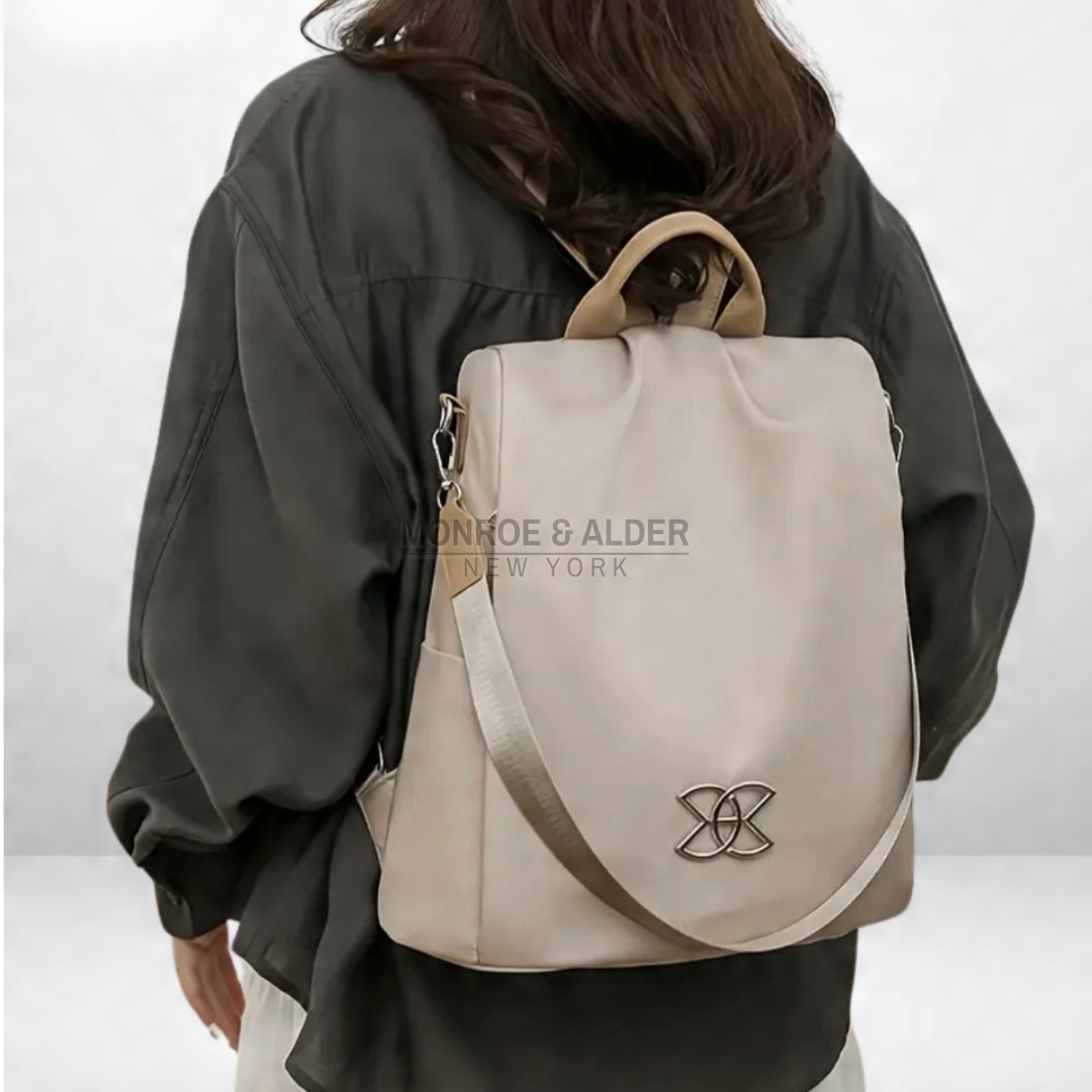 Rosanne anti-theft bag in beige worn on the back