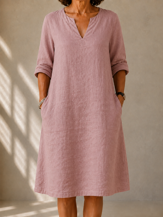 Doris dress in Dusty Pink, front view showing the split V-neck and rolled sleeves