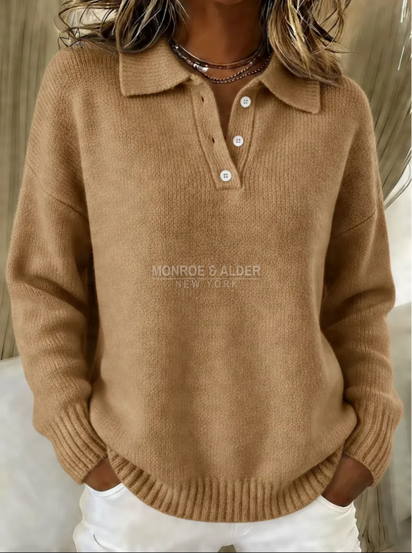 The ribbed cuff and dropped shoulder of the Sheila sweater in camel