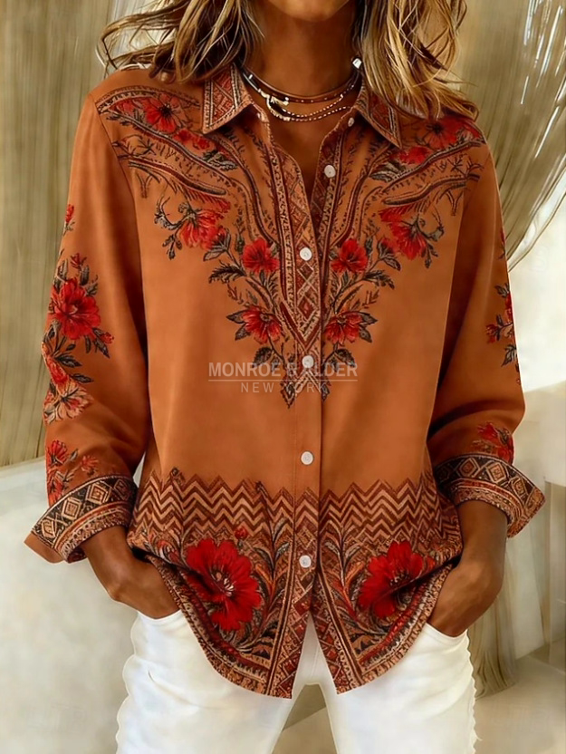 Theresa rust blouse with a red floral border print, front view