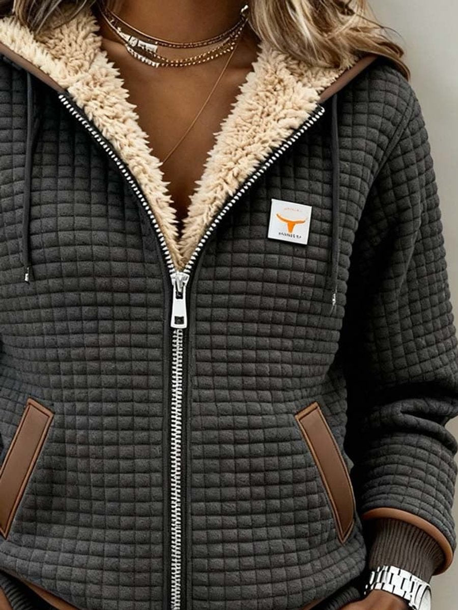 Close view of the sherpa-lined hood and full-length zipper on the Wanda jacket