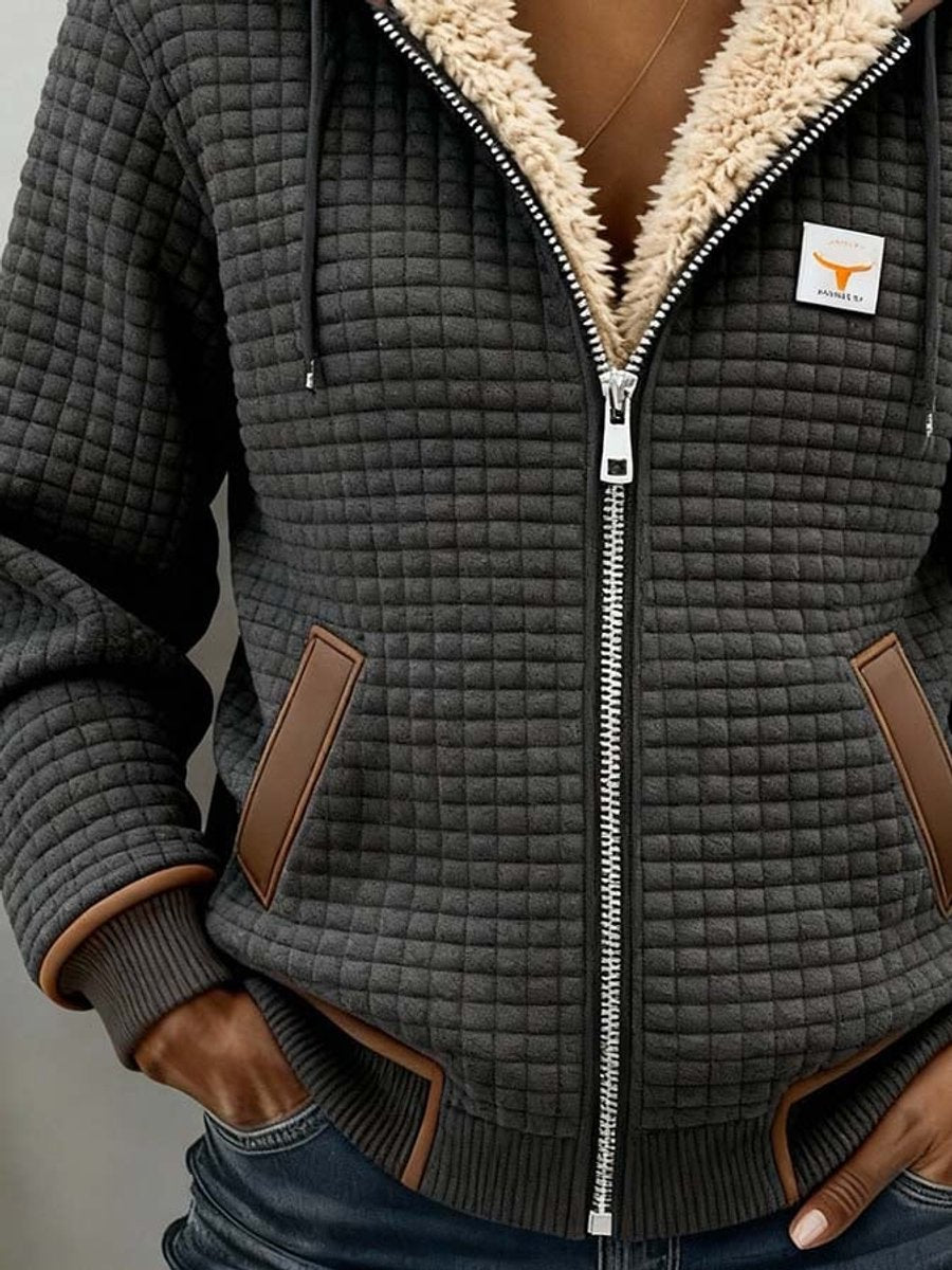 Wanda jacket in charcoal showing the brown contrast trim at the pockets and hem