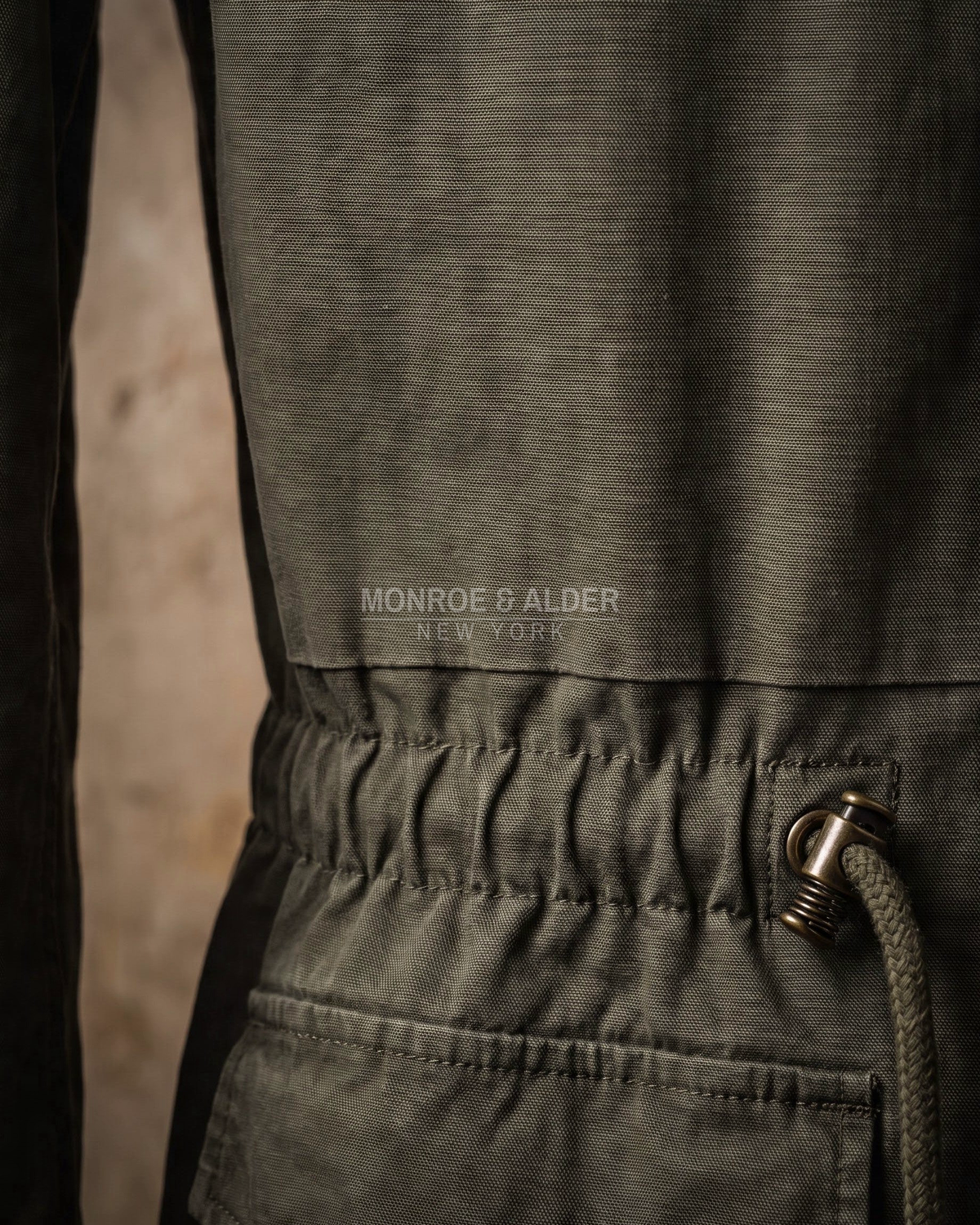 Close view of the washed cotton canvas texture on the Wyatt field jacket