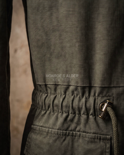 Close view of the washed cotton canvas texture on the Wyatt field jacket